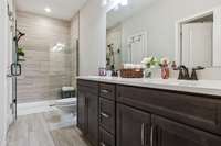 Primary bath features a large double vanity & tile flooring. 549 Montrose Dr. Mt. Juliet, TN 37122