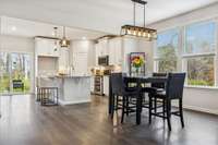 Enjoy a meal by your double windows providing peaceful views in your dining area with farmhouse chandelier. 549 Montrose Dr. Mt. Juliet, TN 37122