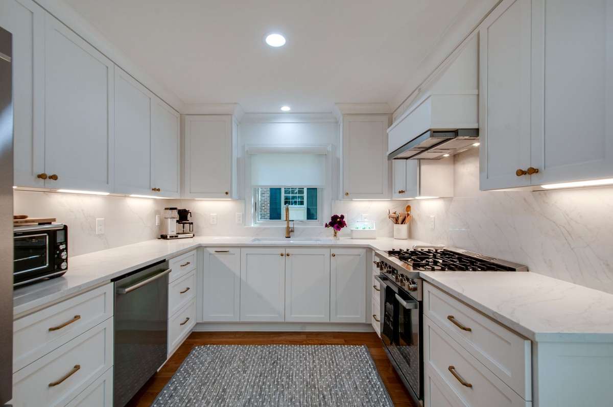 The chef worthy kitchen was meticulously curated with Swincraft cabinets, quartz countertops and backsplash, and state of the art appliances.