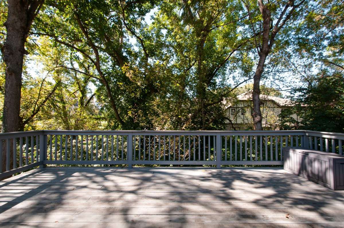 The retreat style generously sized deck is surrounded by mature and lush landscaping and offers great privacy and ample space for everyday living and entertaining.