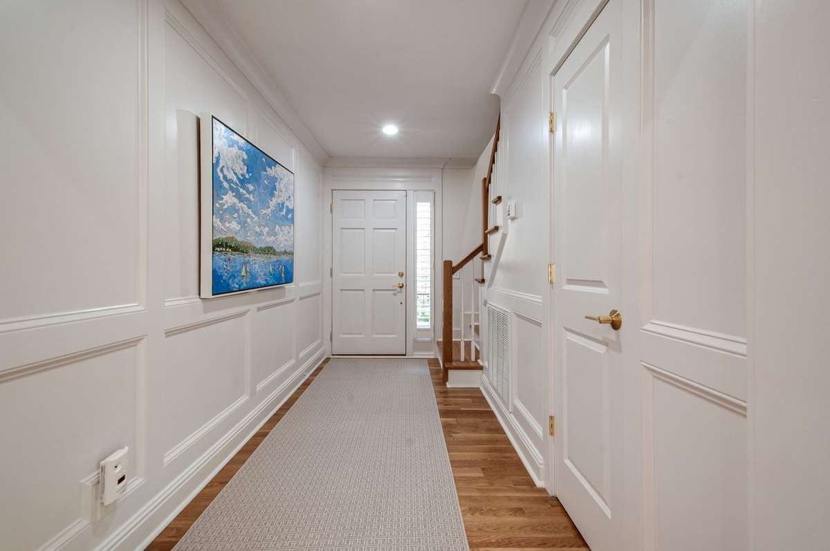 Refined picture molding, gleaming hardwood floors, and a welcoming sense of warmth and sophistication.