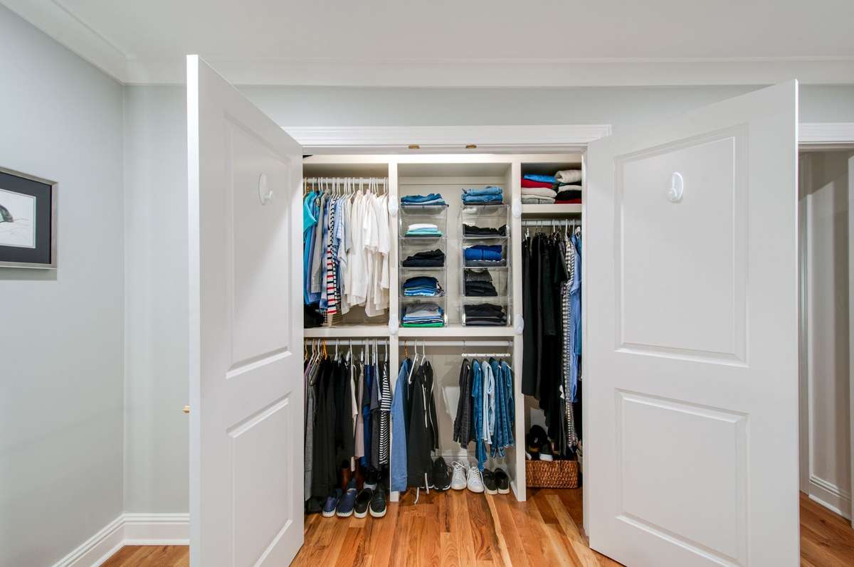 Custom designed closet in primary bedroom
