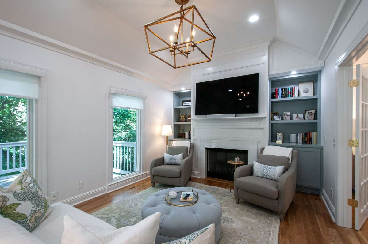 A brand new gas fireplace serves as the centerpiece of the great room, flanked by custom built-ins on each side that add both style and functionality.