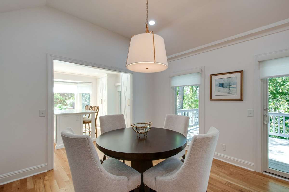 The dining space enjoys the same lovely natural light and has a gorgeous Visual Comfort chandelier.