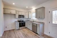 LUXE Kitchen featuring Upgraded Cabinetry + Full Granite Package