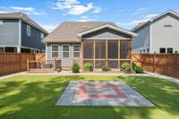 Low maintenance, Turf yard with firepit and garden beds