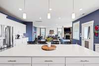 Large quartz island is perfect for meal prep, and entertaining.