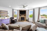 Cozy great room adjacent to the kitchen complete with gas fireplace.