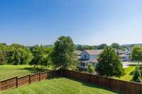Large fenced in yard with great views from the main level porch