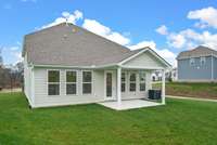 Outside captures a beautiful covered porch, GAS stub for your future grill/firepit and a yard that all 4 sides includes sod & irrigation. Actual Photo of Home