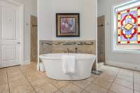 Pretty setting for garden tub as you enter the primary en suite bath