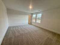 This secondary bedroom has enough space for a sitting area