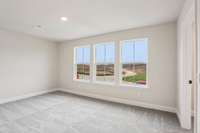 Bedroom #4 is another large bedroom located on the 2nd floor. Natural light floods into this room from the large windows.