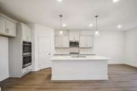 Bar stool seating is perfect for quick meals at the island.