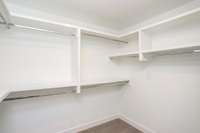 Primary bedroom closets with NO WIRE SHELVING
