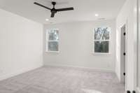 Step into the expansive owner’s bedroom, where luxury meets comfort. This generous space offers a serene retreat, complete with large windows that flood the room with natural light and provide stunning views.