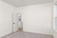 Another view of your welcoming secondary bedroom featuring generous dimensions, this room offers plenty of space for relaxation and personalization.