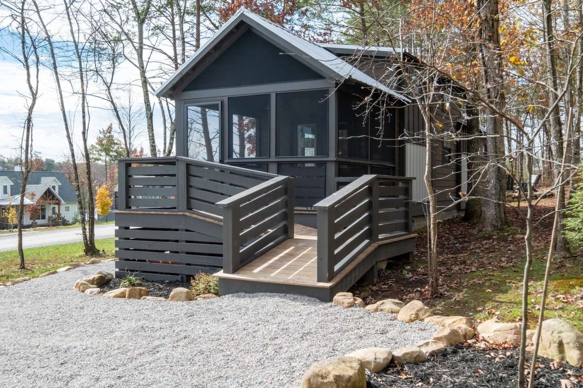 This charming cottage at the Retreat at Water's Edge sits a mere steps from the 95 acre lake that is the center of the community