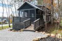 This charming cottage at the Retreat at Water's Edge sits a mere steps from the 95 acre lake that is the center of the community