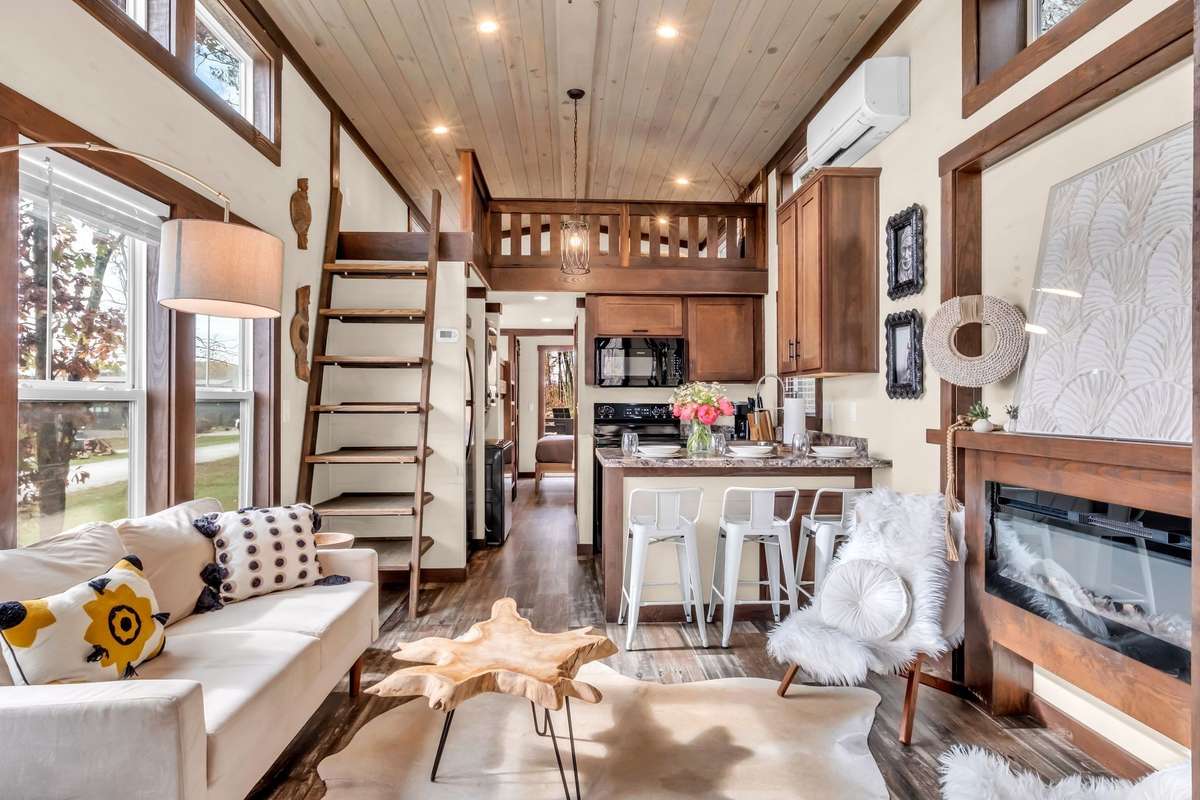Beautifully appointed great room with an abundance of natural light and a vaulted ceiling