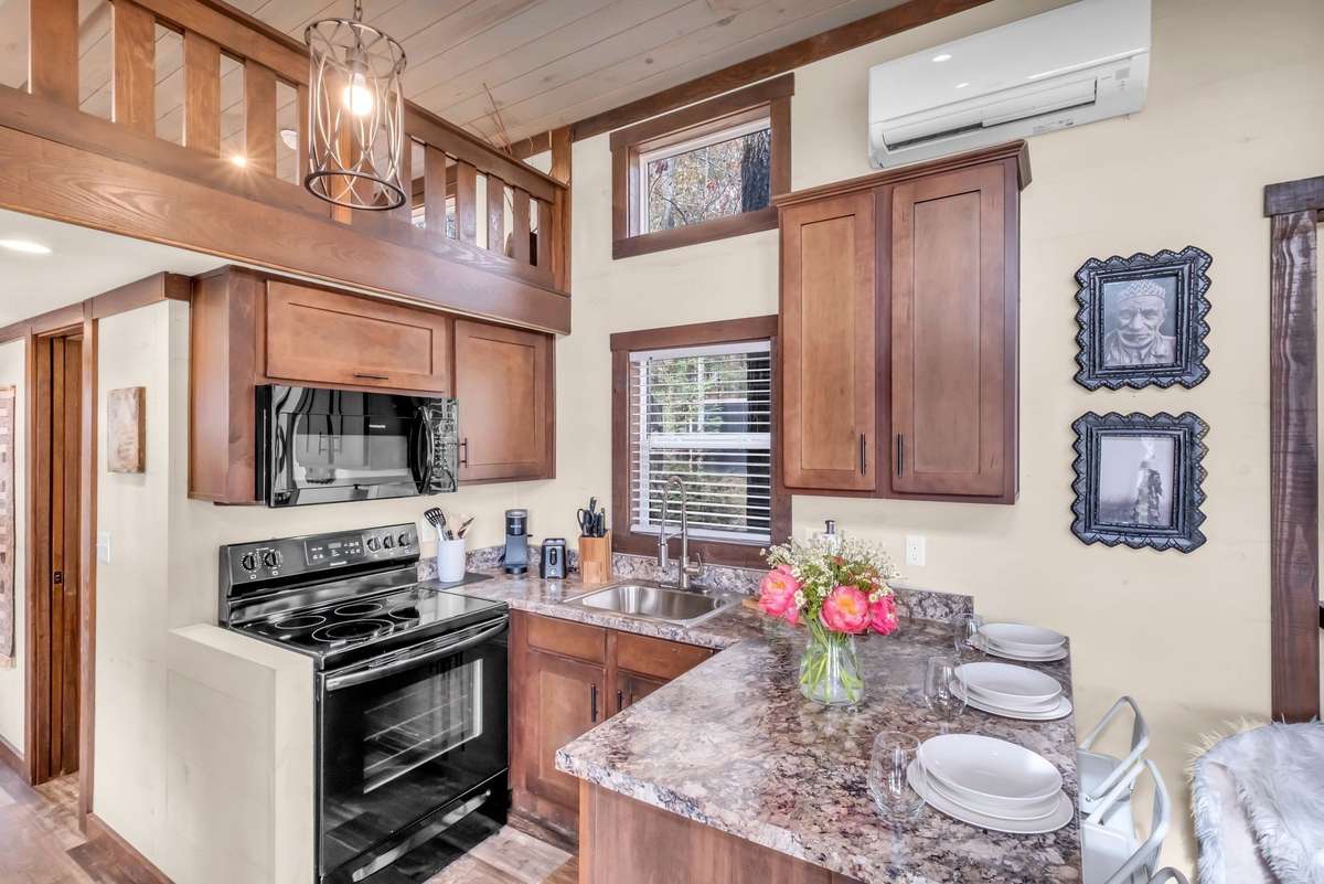 The cute kitchen has everything you need including a small dishwasher, plenty of counter space and gets a ton of natural light!