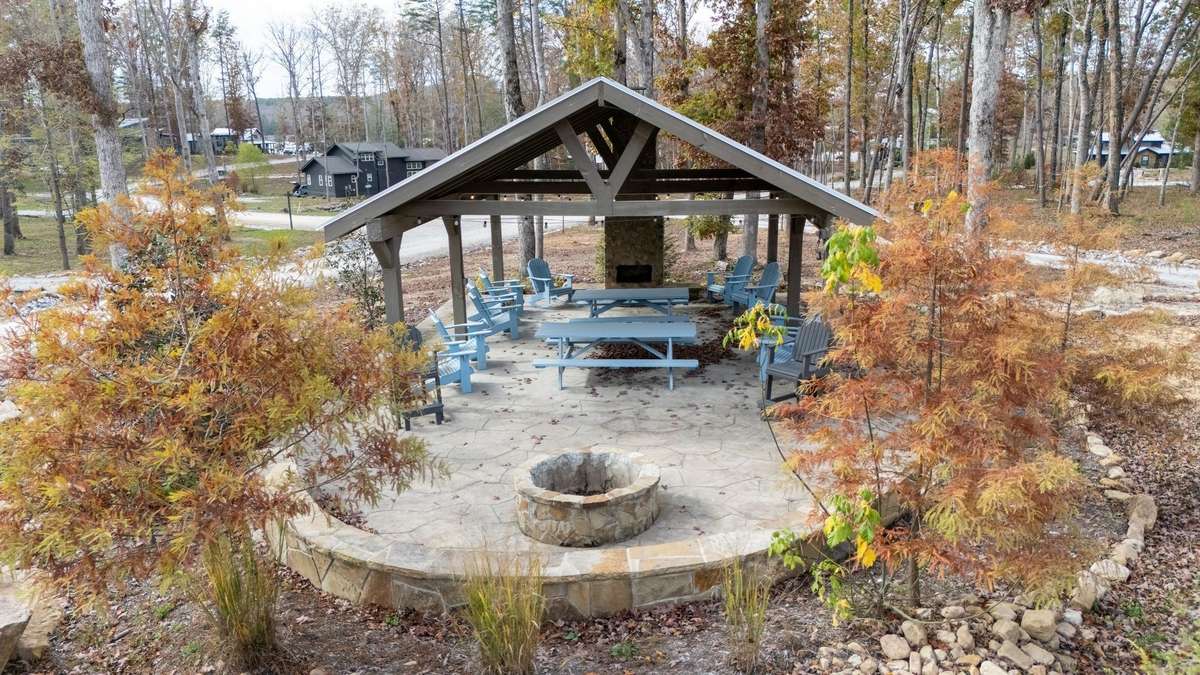 A community pavilion with a fireplace and a fire pit for the enjoyment of residents and guests of the Retreat at Water's Edge