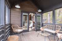 The screened-in porch has ample space to relax and entertain