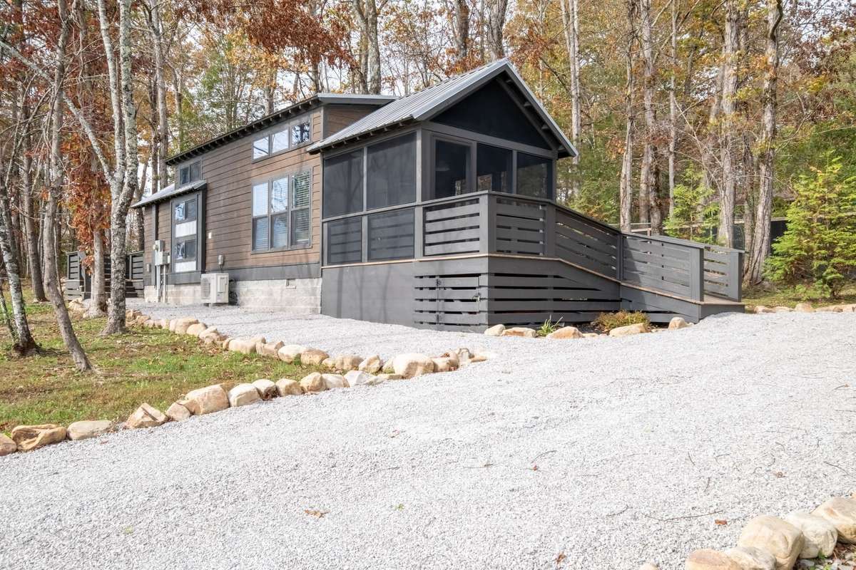 A gravel driveway leads up to the house and it easily accommodates 3 cars