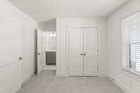 Secondary bedrooms have a jack and jill bath. Picture not of actual home but similar model.