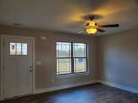 Buyer can choose Color of LVP Flooring for the Living Room.  Picture of Previous House.