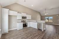 Upgraded Stainless Smooth Top Stove, Microwave and Dishwasher are provided.