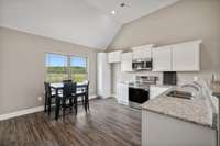 Cook's Kitchen features Extra Cabinets and Counter tops for preparing and serving food.