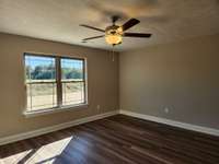 Spacious Living Room has Wide Plank Flooring and a Ceiling Fan!
Picture of Similar House.