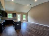 Kitchen has Large Island and Spacious Dining Area. 
Photo of Previous House.