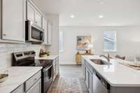 “Photos are for staging and illustration purposes only and may not represent the exact home. Finishes may vary.”