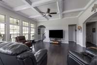 Great room with open concept. Coffered Ceiling, Ceiling fan, Recessed lighting, hardwood floors, and tons of windows. Shades on all windows for privacy when needed. Easy access to laundry room, garage, and all downstairs bedrooms and bathrooms.