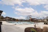 Large Pool with Splash pads and umbrella shaded areas,