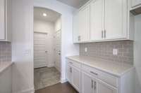 This photo is a sample of the Sutherland floorplan.  Options and exterior will vary depending on customer selections and preferences.