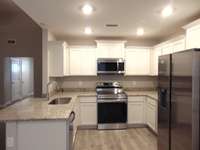 This kitchen is perfect for you to cook all your favorite dishes, the kitchen comes with steel appliances, crown cabinetry, under cabinet lighting, and plenty of cabinets for you to store all your goods.