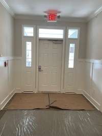 Entrance of the building.  All media are of a previous building.  Actual colors are in the photos