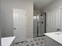 Master tile shower.  Water closet.