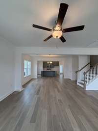 Family to Kitchen view.  Open concept plan.  (Not actual home so may show colors not being built in actual home)