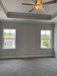 Master bedroom with lots of windows