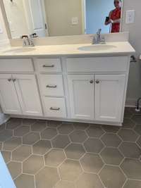 Master bath with double bowl vanities and tub shower combo