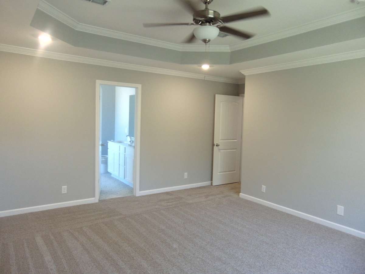 The primary bedroom has a lovely tray ceiling with led lights, as well as a large private bathroom.