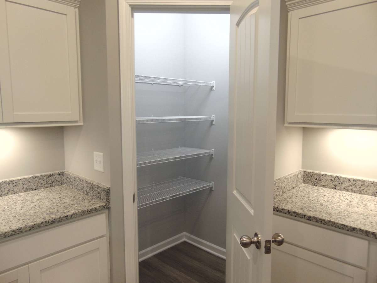 The kitchen where you can cook all your specialty dishes with love. This kitchen has under cabinet lights, included steel appliances, as well as a modern and large island and sink.