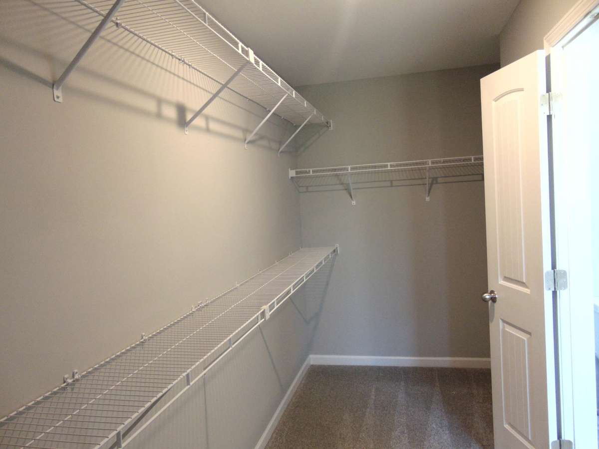 The primary bath includes a modern soaking tub for relaxation, and a shower. As well as two sinks, an elongated toilet, and your spacious closet.