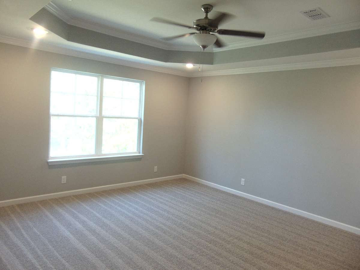 The primary bedroom has a lovely tray ceiling with led lights, as well as a large private bathroom.