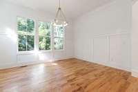 Custom board and batten trim work encircles the dining room.