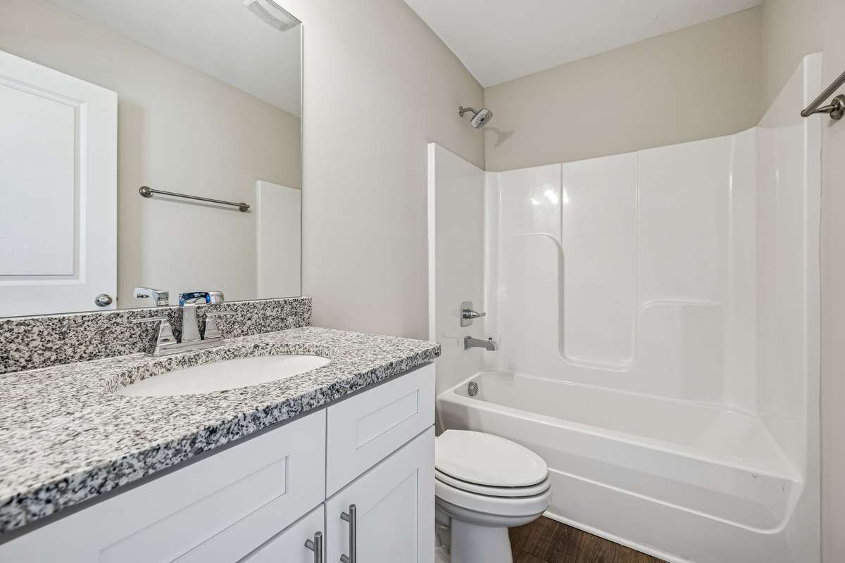 Secondary Bathroom, tall vanity. Every bathroom features elongated toliets